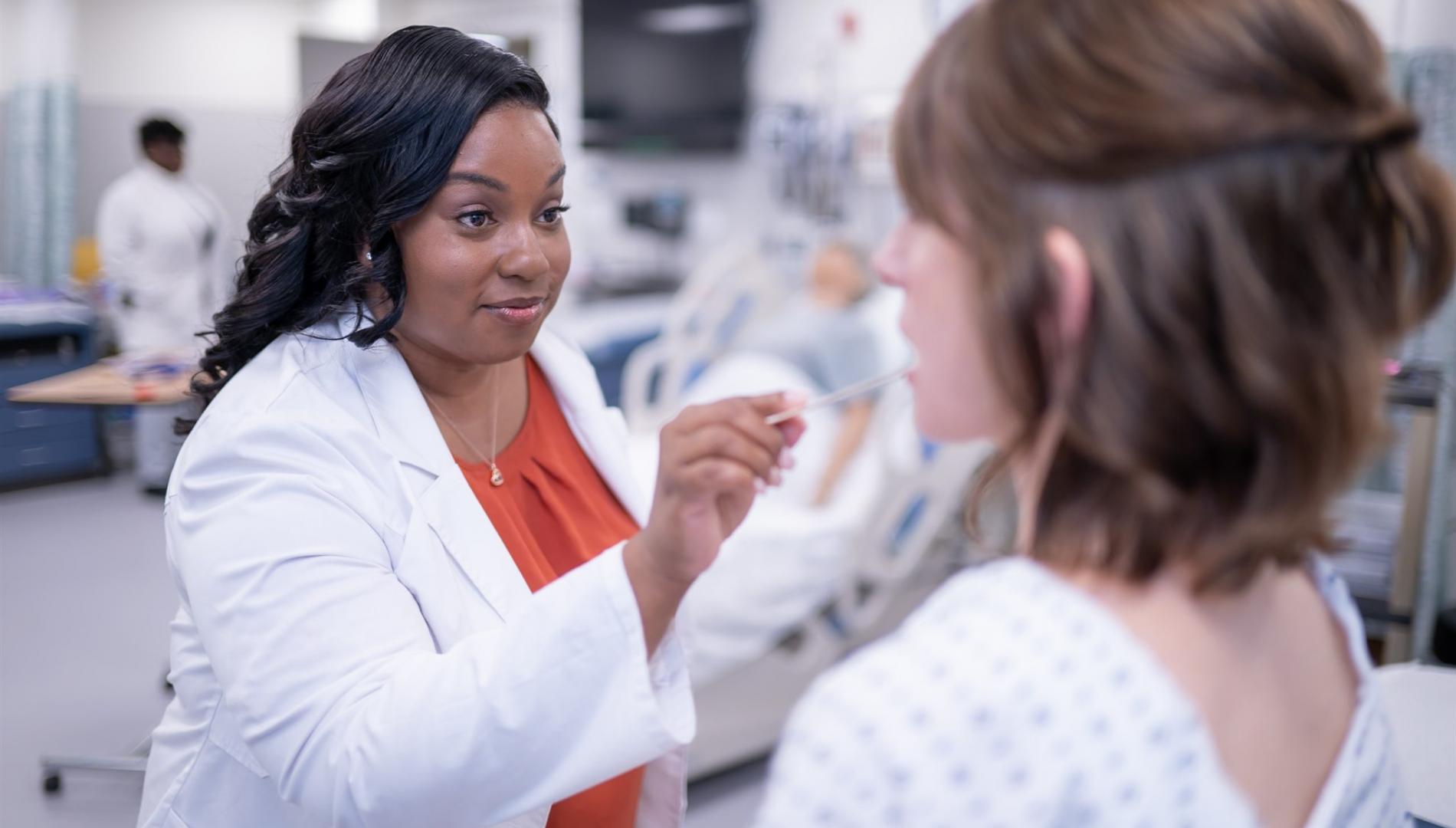 Nursing student with patient 